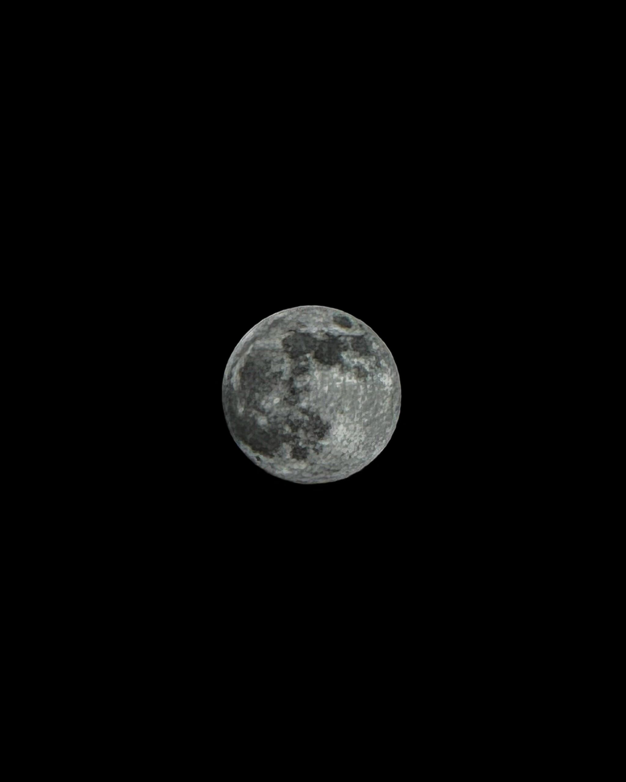 Full moon alone in a black sky